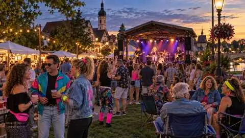 Festivalgoers enjoying a retro outdoor music event in Frankenmuth.